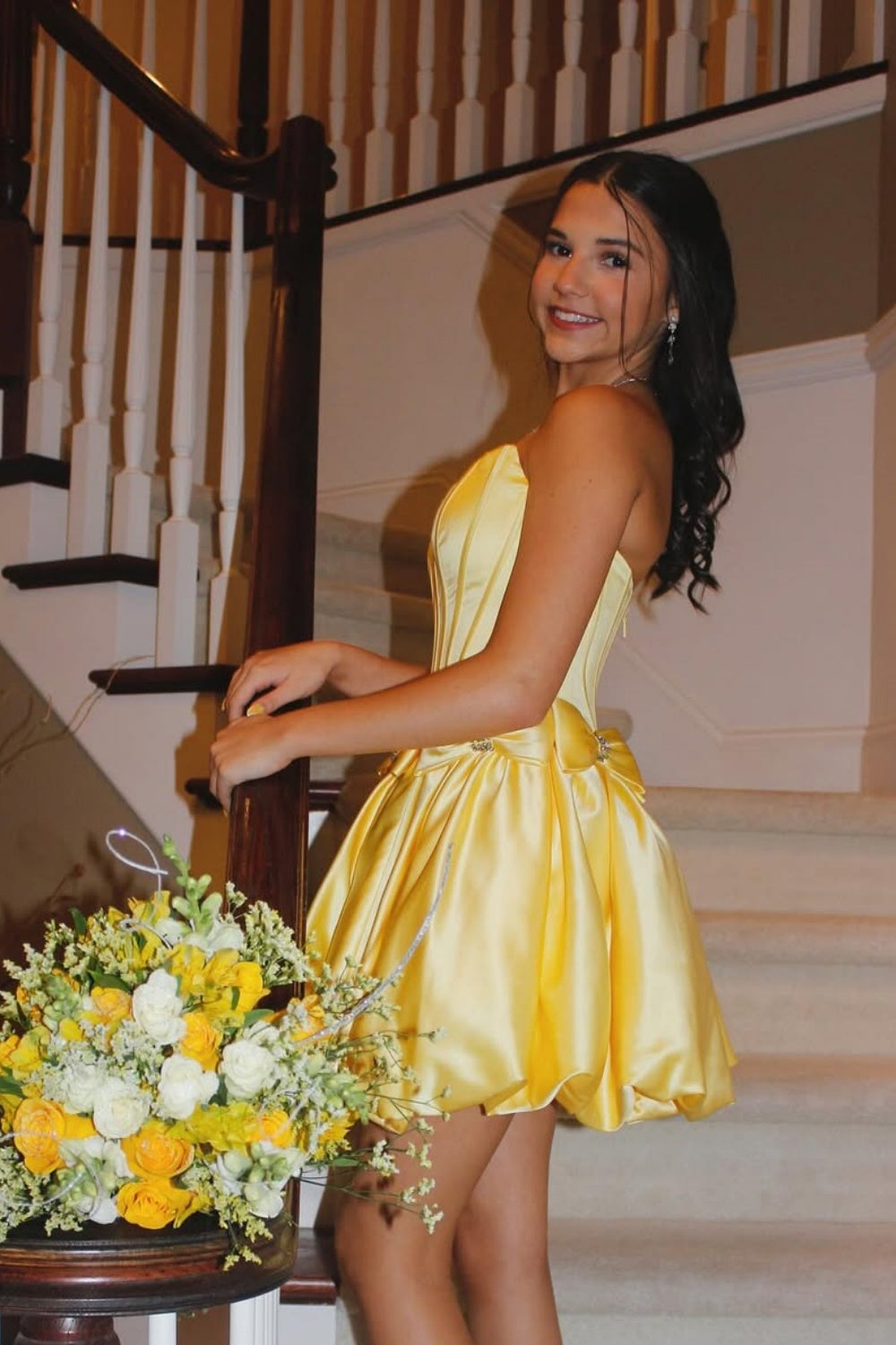 Yellow strapless A-line mini dress with a wrap-around bow.