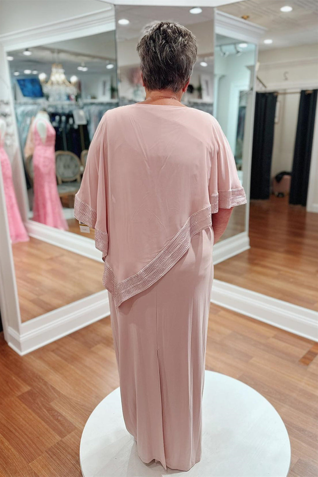 Pink satin long Mother of the Bride dress with draped sleeves and side slit.