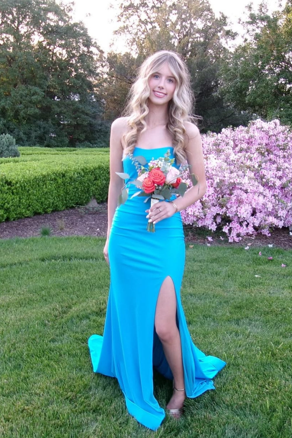 Strapless royal blue satin mermaid prom dress with side slit and ruching.
