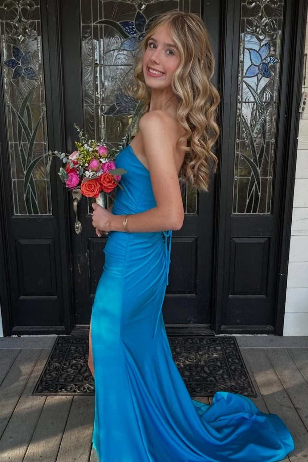Strapless royal blue satin mermaid prom dress with side slit and ruching.