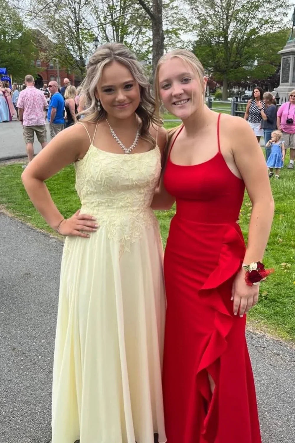 Flowy yellow chiffon A-line prom dress featuring delicate lace appliques and a double strap back design.