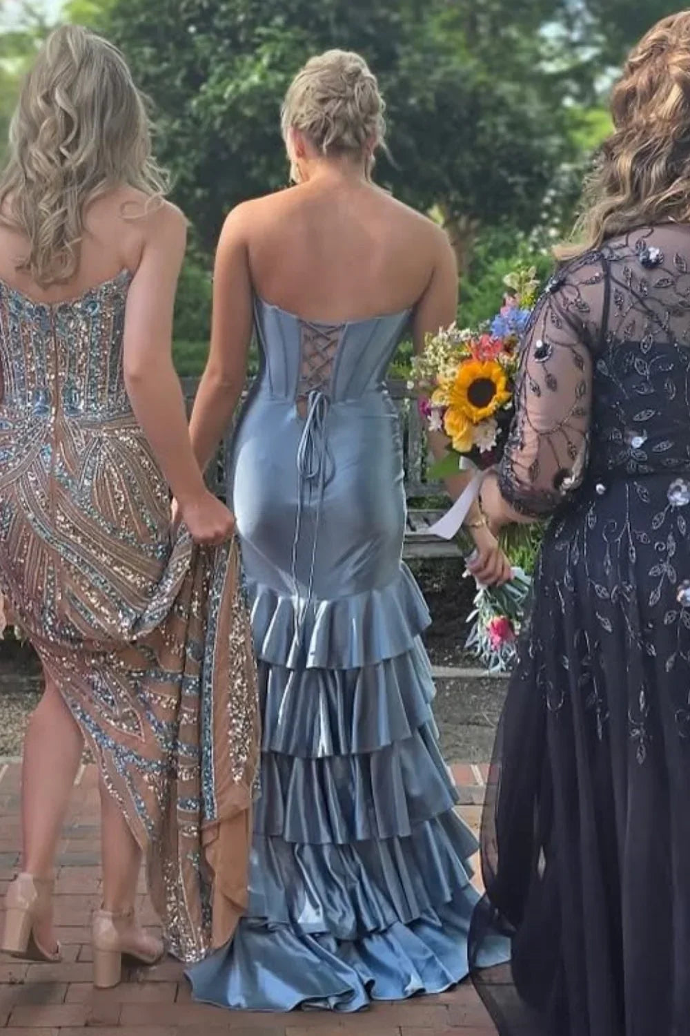 Romantic dusty blue A-line prom dress featuring a sweetheart neckline, tiered ruffle skirt, and adjustable lace-up back.