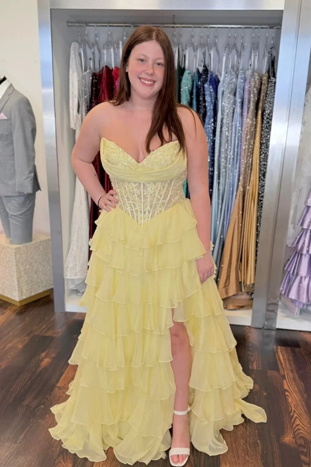 Elegant yellow chiffon ball gown featuring a strapless illusion bodice adorned with delicate lace appliques.