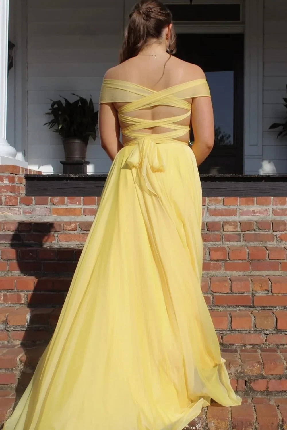 Radiant yellow A-line chiffon prom gown featuring an off-the-shoulder neckline, pleated bodice, and illusion details.