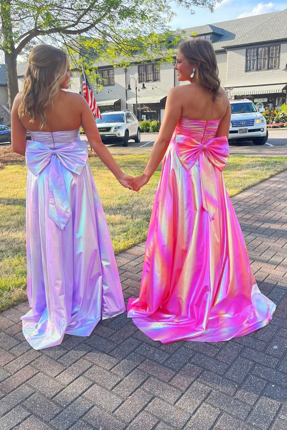 Purple ruched A-line long dress with leg slit and bow back detail.