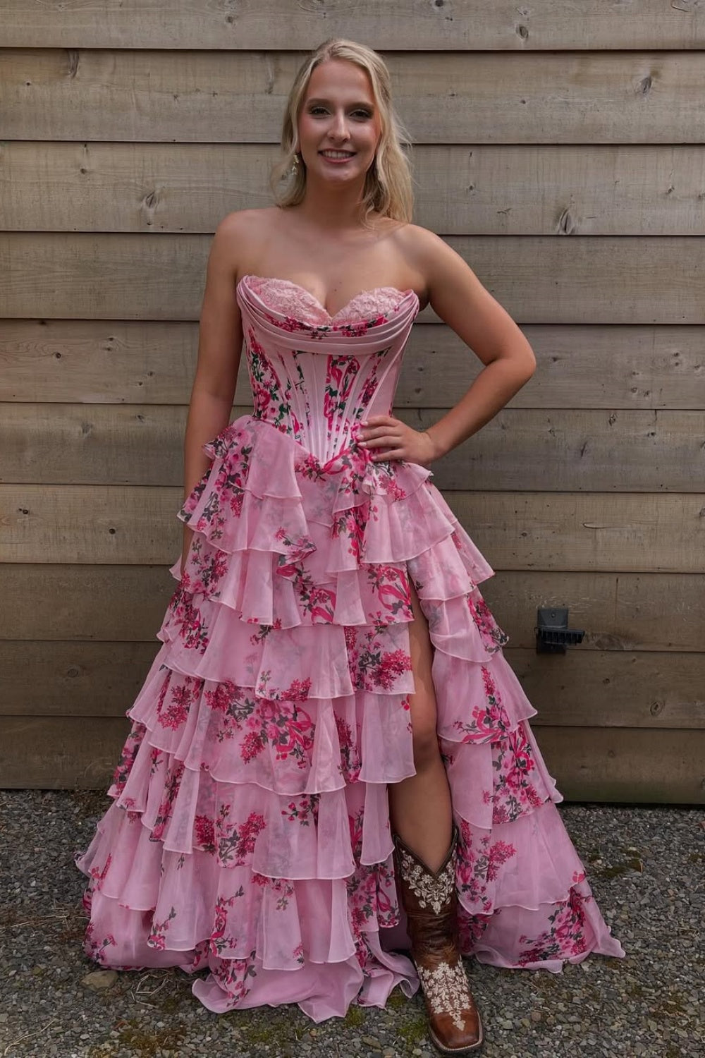 Floral print chiffon A-line gown with lace appliques and ruffled slit.