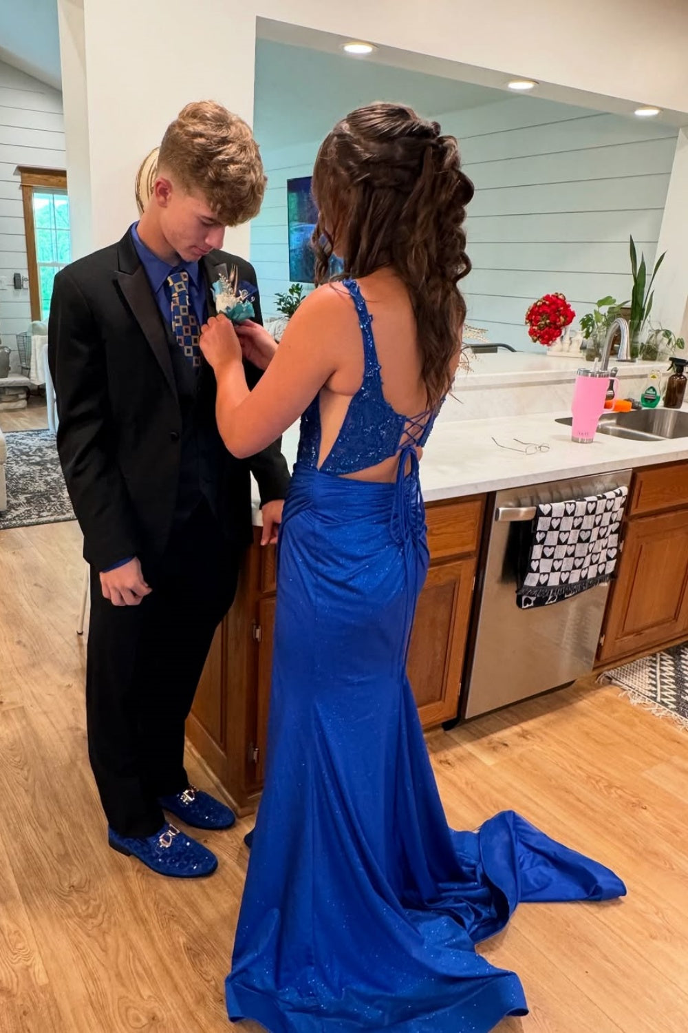 Royal blue plunging V-neck mermaid dress with intricate beadwork.