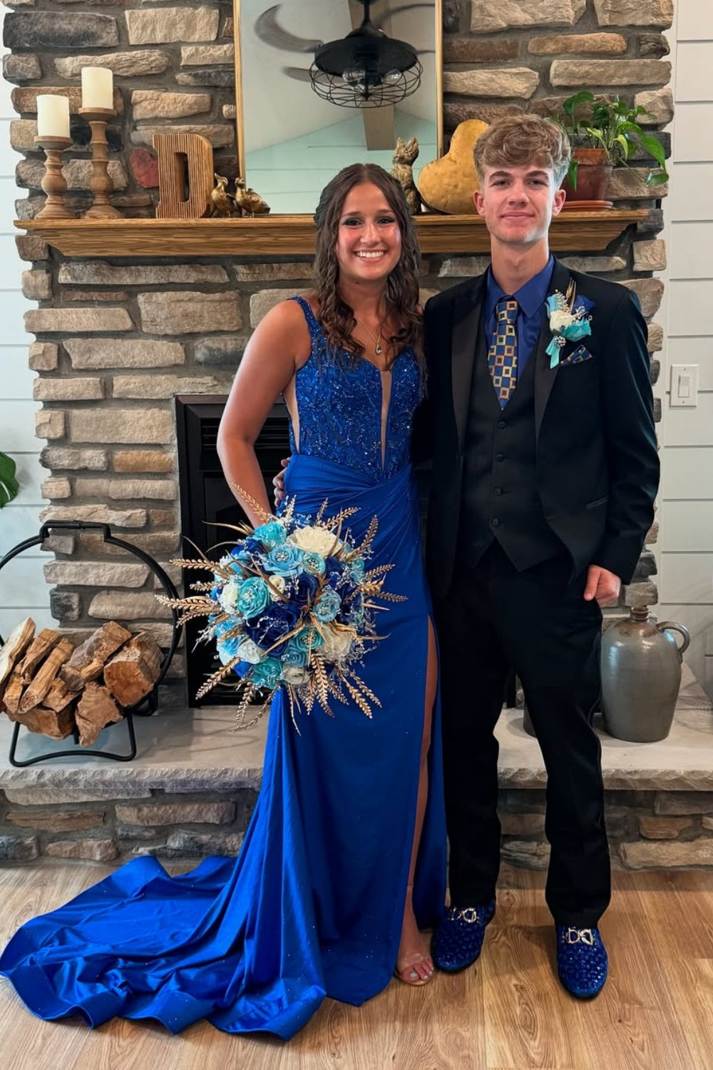 Royal blue plunging V-neck mermaid dress with intricate beadwork.