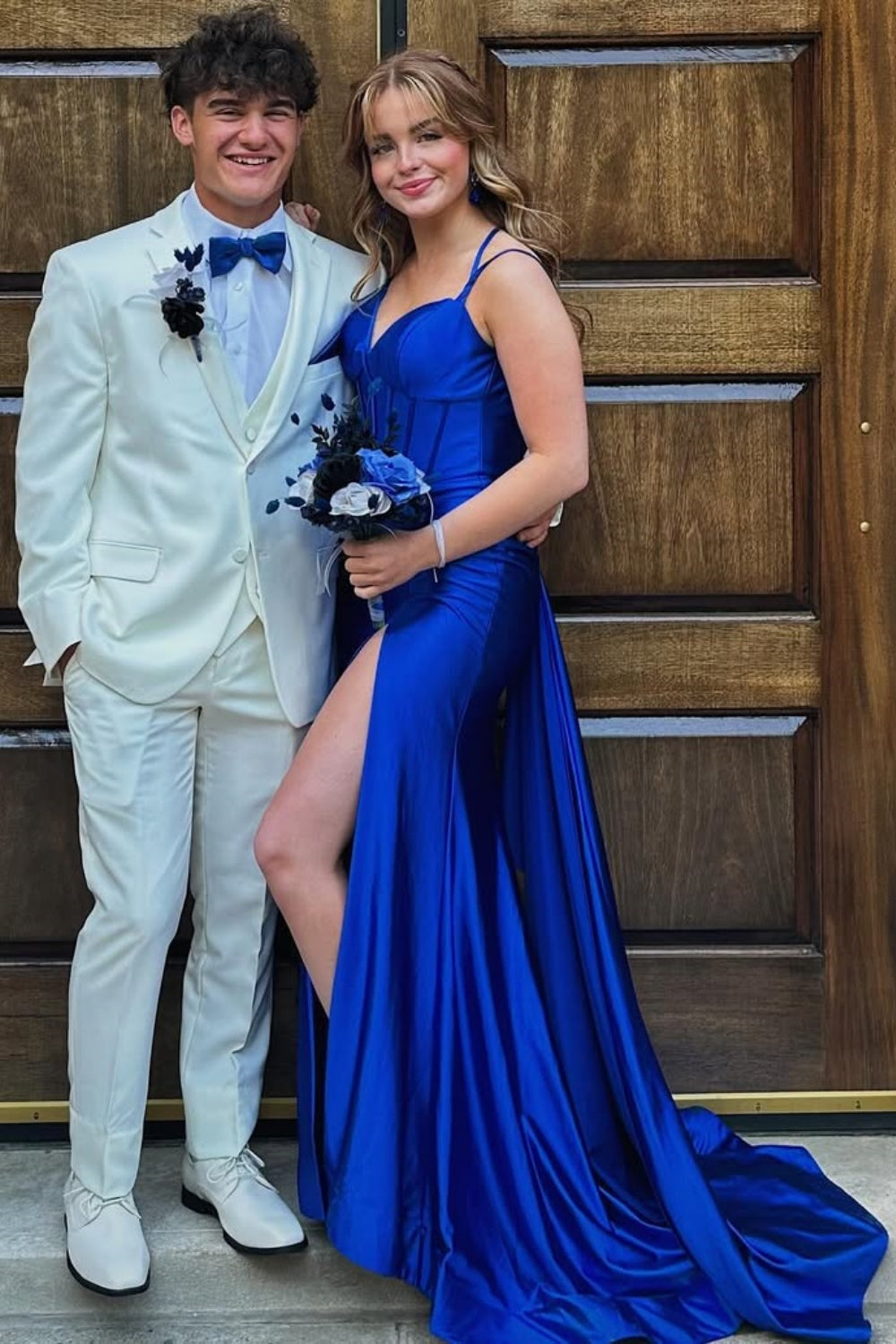 Royal blue mermaid prom dress featuring a corset bodice, double shoulder straps, high leg slit, and matching shawl.