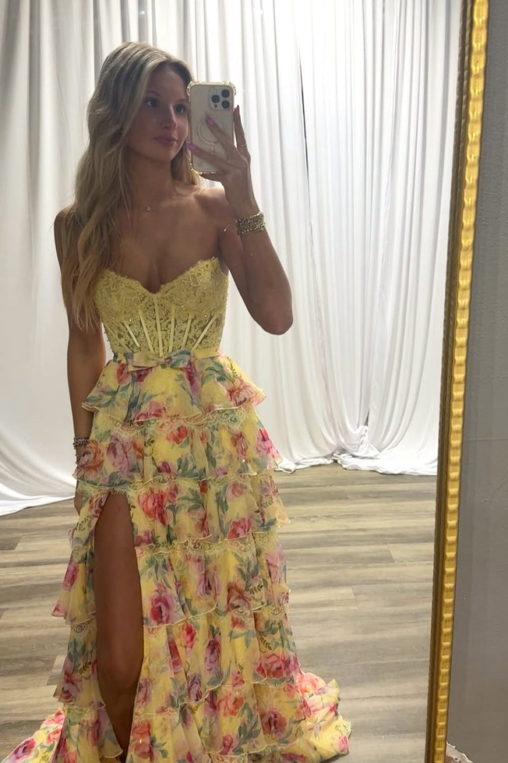 Strapless A-line tiered chiffon prom dress with floral lace appliques.