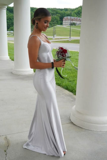 Long silvery fitted round neck formal dress featuring a leg slit.
