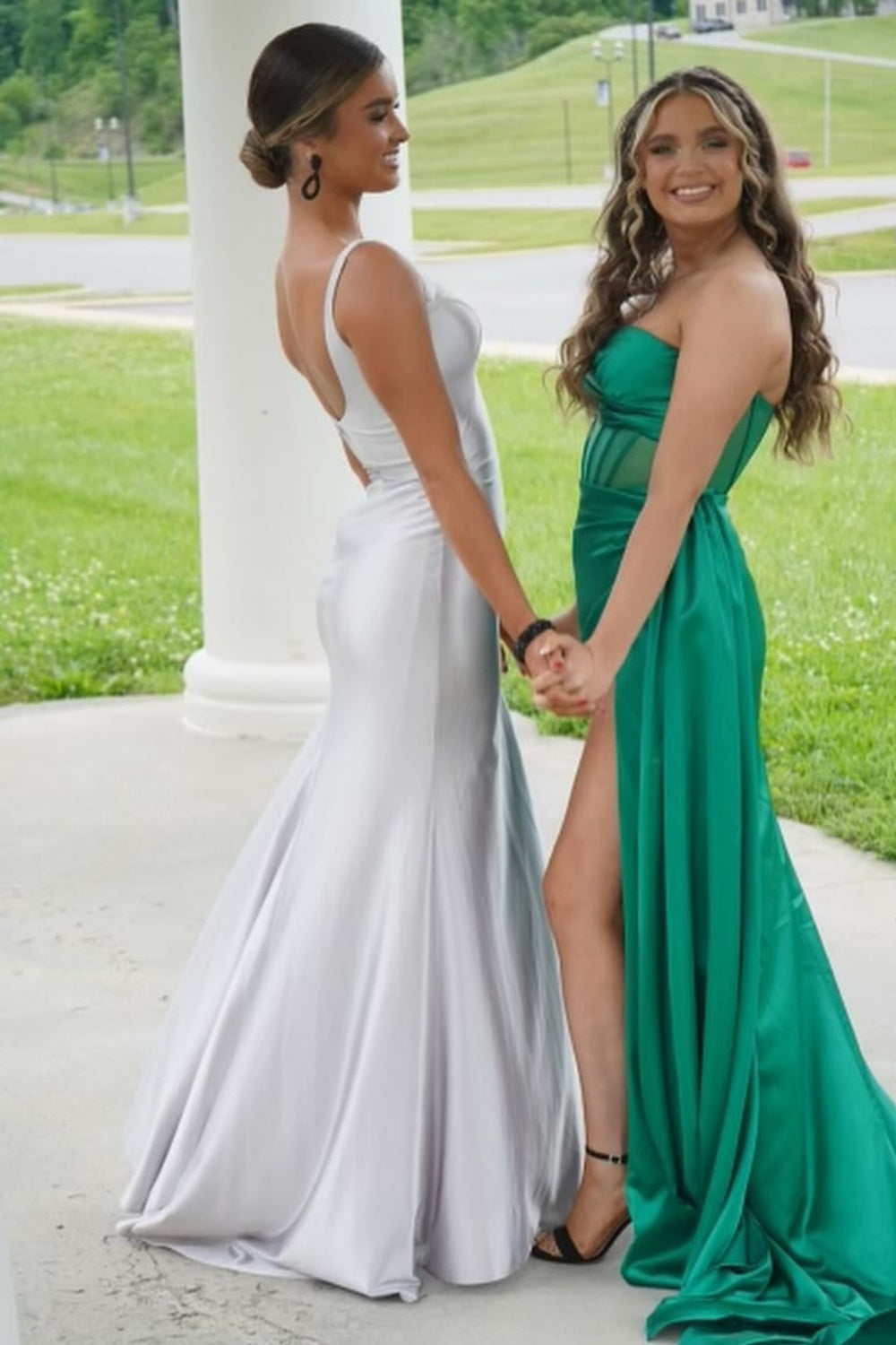 Long silvery fitted round neck formal dress featuring a leg slit.