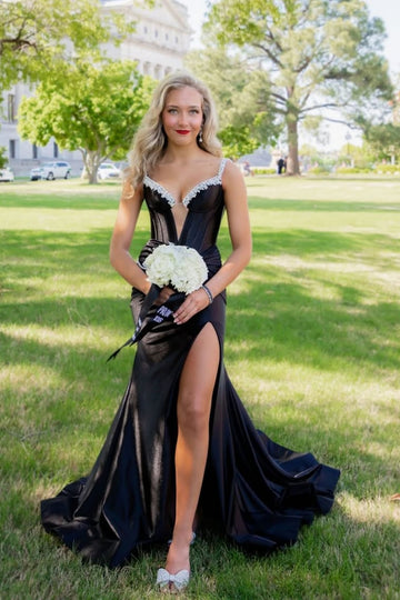 Black mermaid prom dress featuring a beaded plunging V-neck and leg slit.