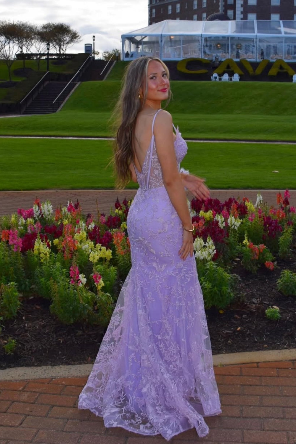 Purple plunging V-neck mermaid prom dress with floral lace appliques.