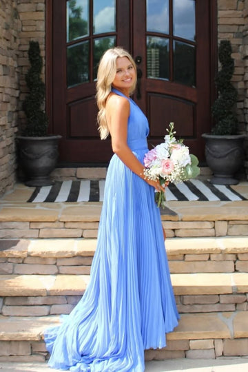 Halter neck pleated chiffon A-line gown with open back and side slit.