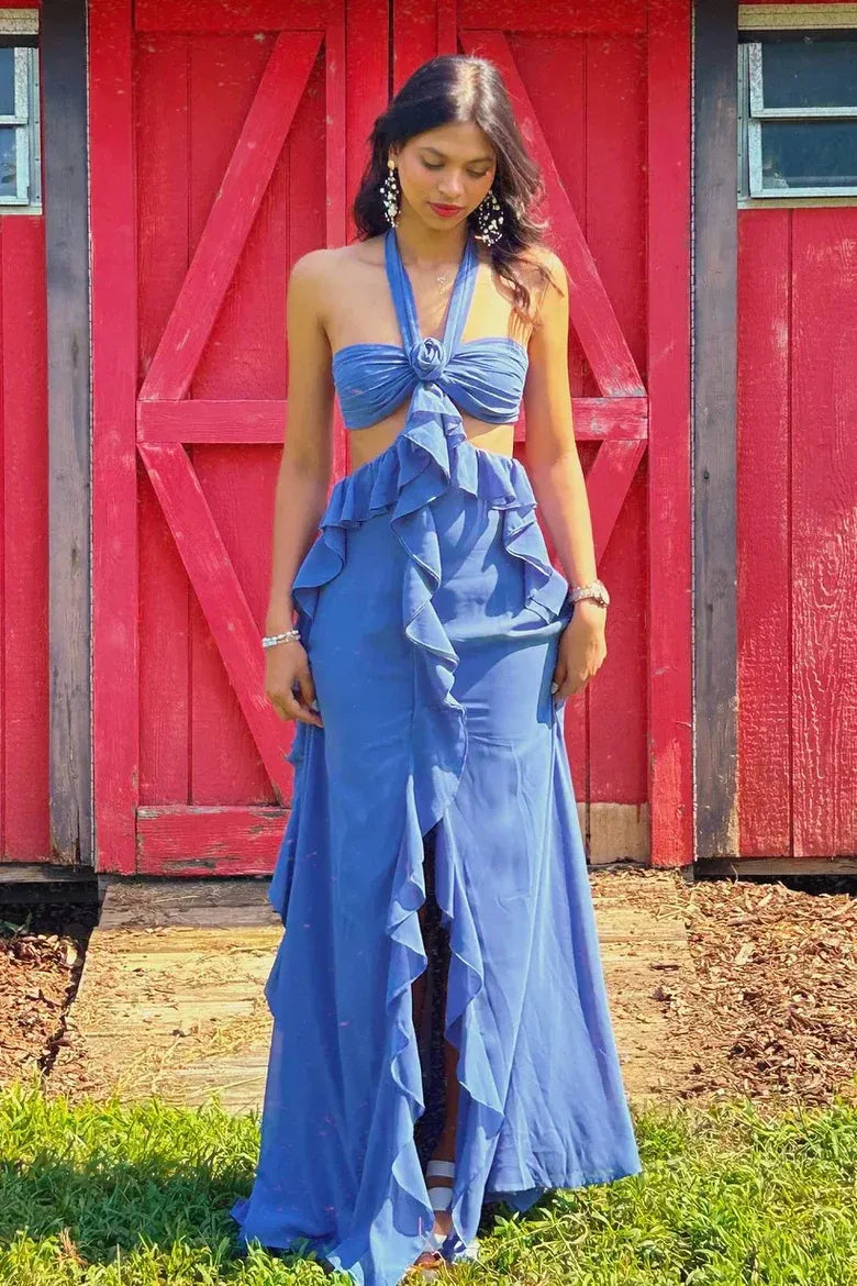 Blue halter mermaid prom dress featuring a decorative flower bow and ruffled skirt.