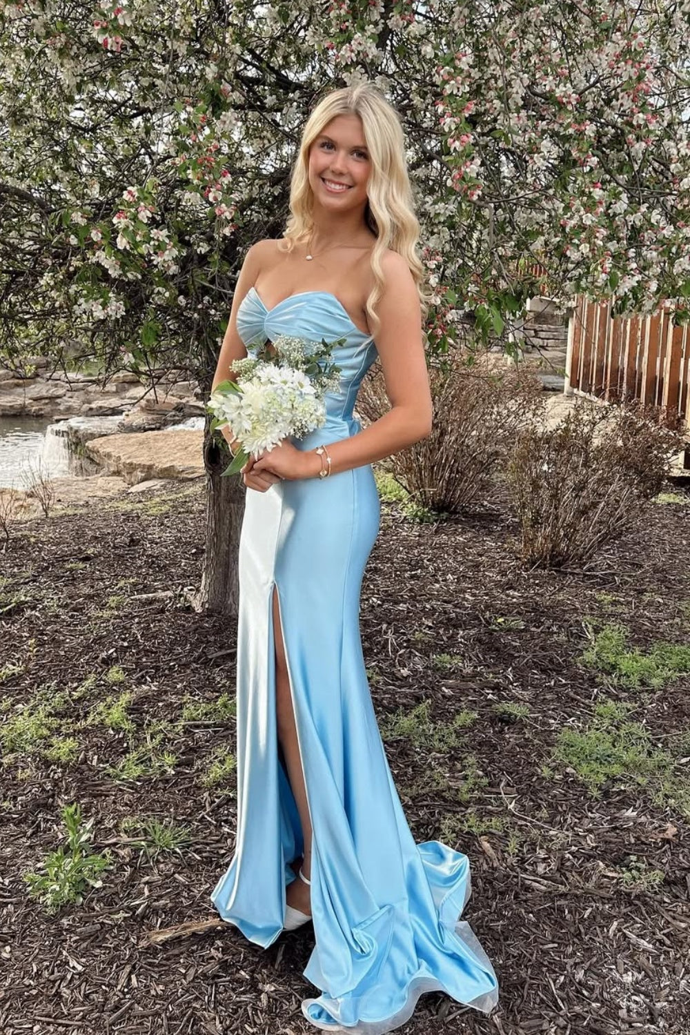 Light blue strapless satin mermaid gown featuring a keyhole neckline and side slit.