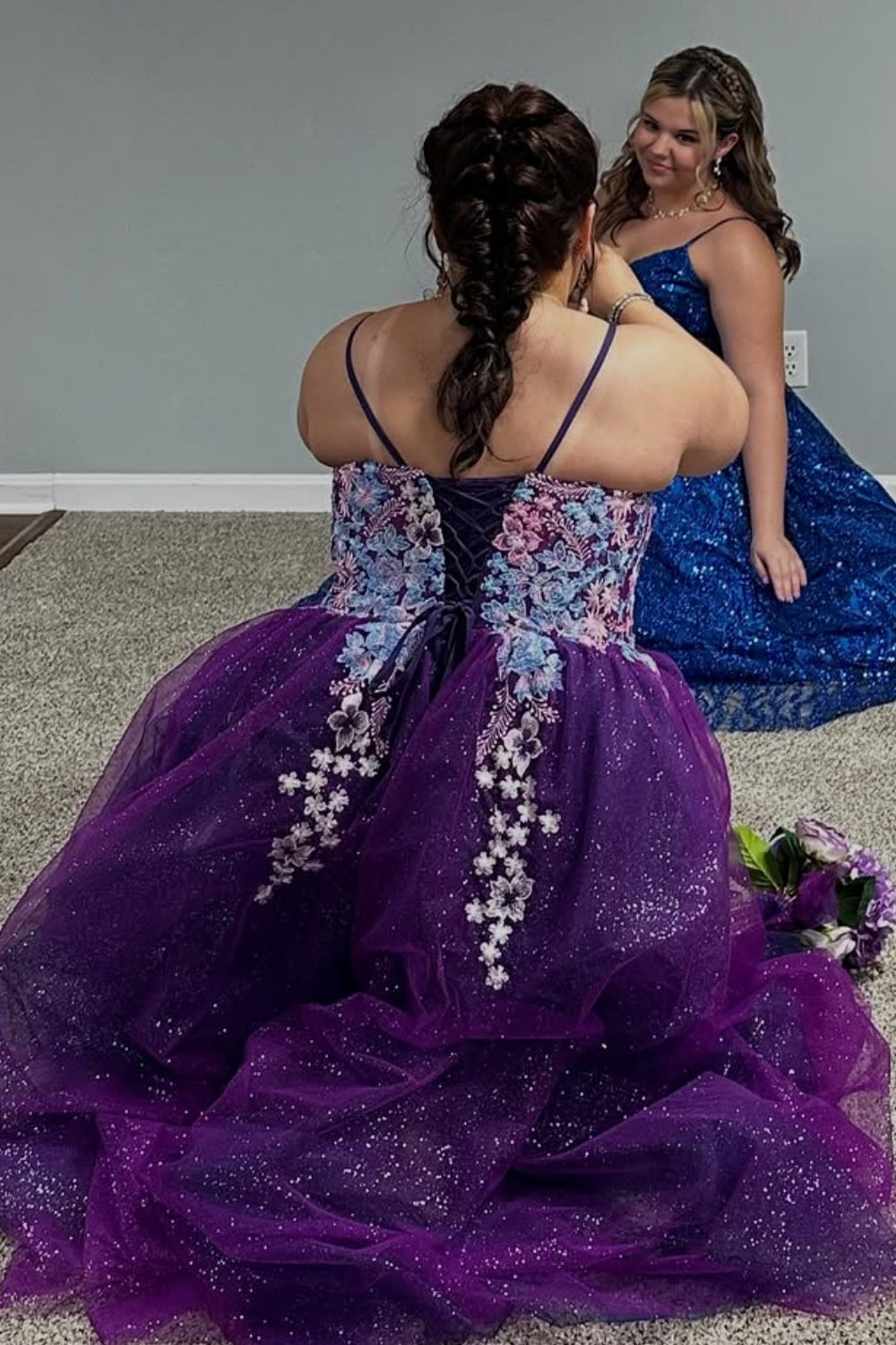 Plus size purple tulle prom dress with spaghetti straps, floral appliques, and sequins.