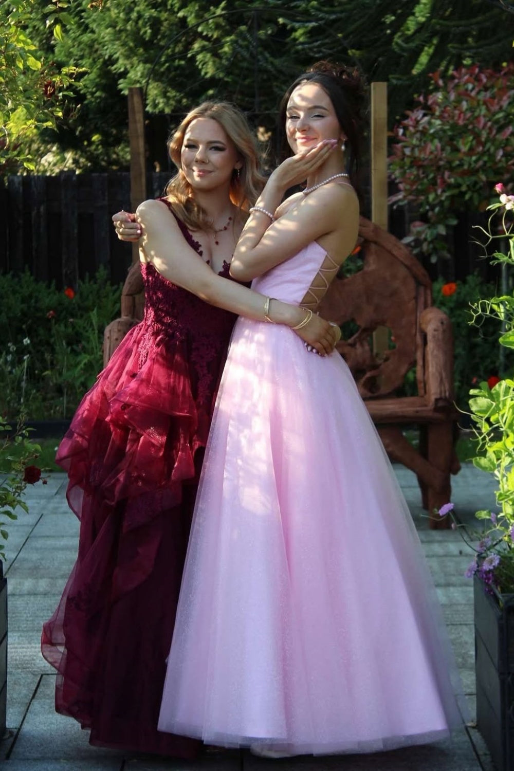 Pink A-line tulle prom dress with puff sleeves and lace-up back