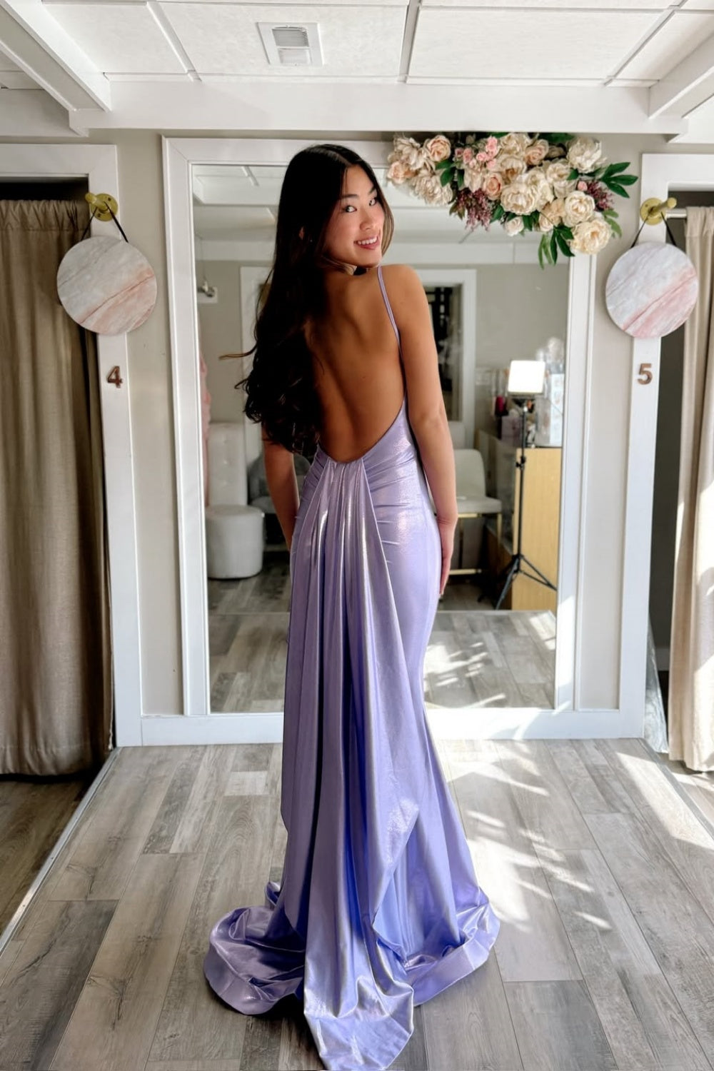 Lavender satin mermaid prom dress with spaghetti straps and long train.