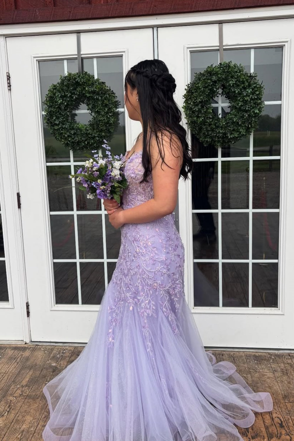 Lavender tulle A-line prom dress with lace appliques and spaghetti straps.