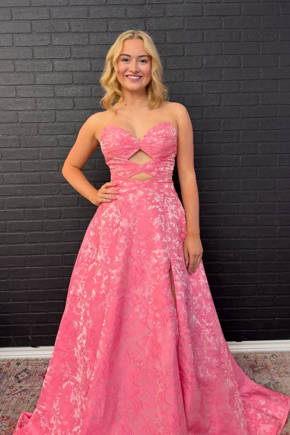 Floral print A-line prom dress with strapless keyhole neckline and lace-up corset back.