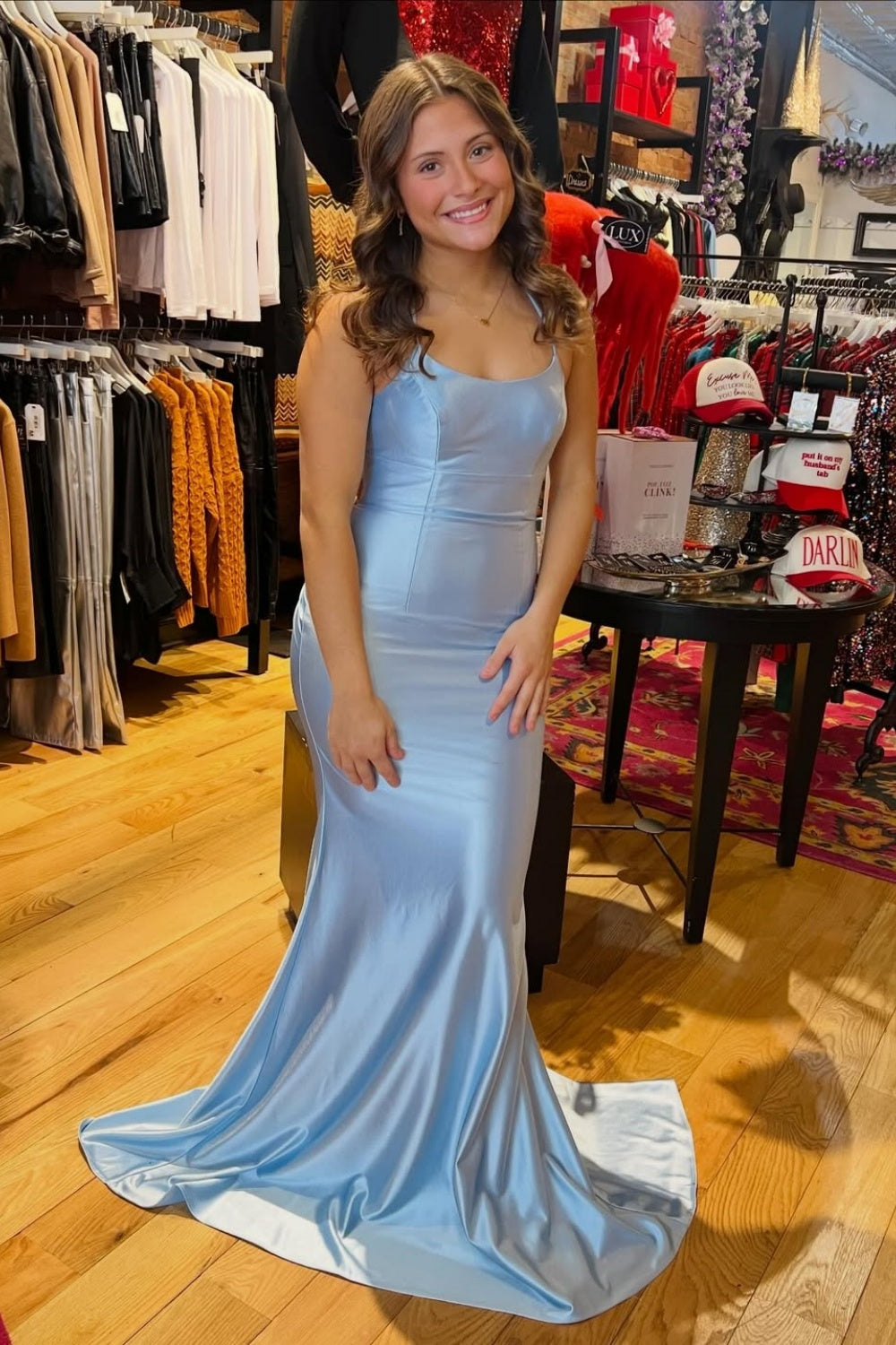 Ruched light blue mermaid prom dress with spaghetti straps.