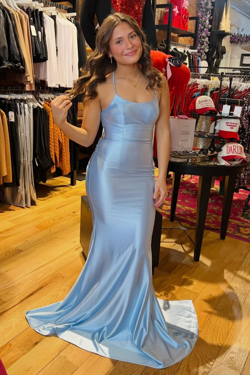 Ruched light blue mermaid prom dress with spaghetti straps.