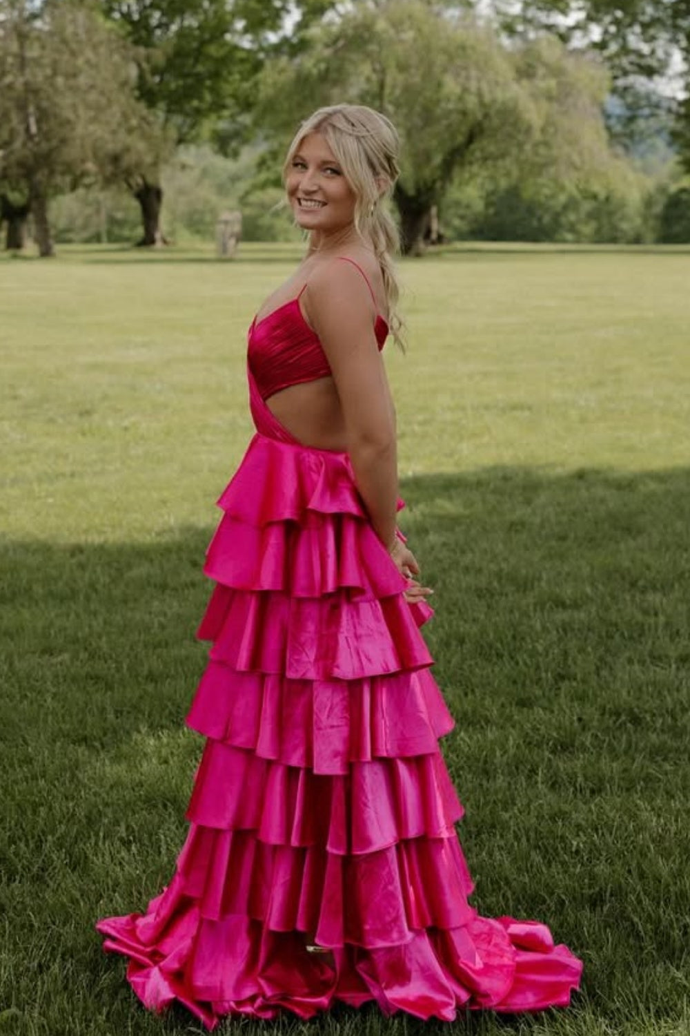 Fuchsia A-line ruffle prom dress with spaghetti straps and criss-cross back.