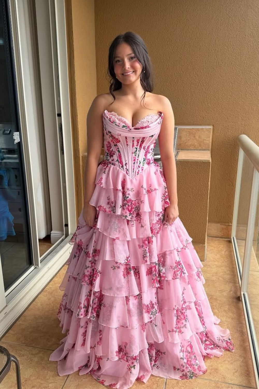sweetheart corset A-line tiered gown with lace appliques and side slit.