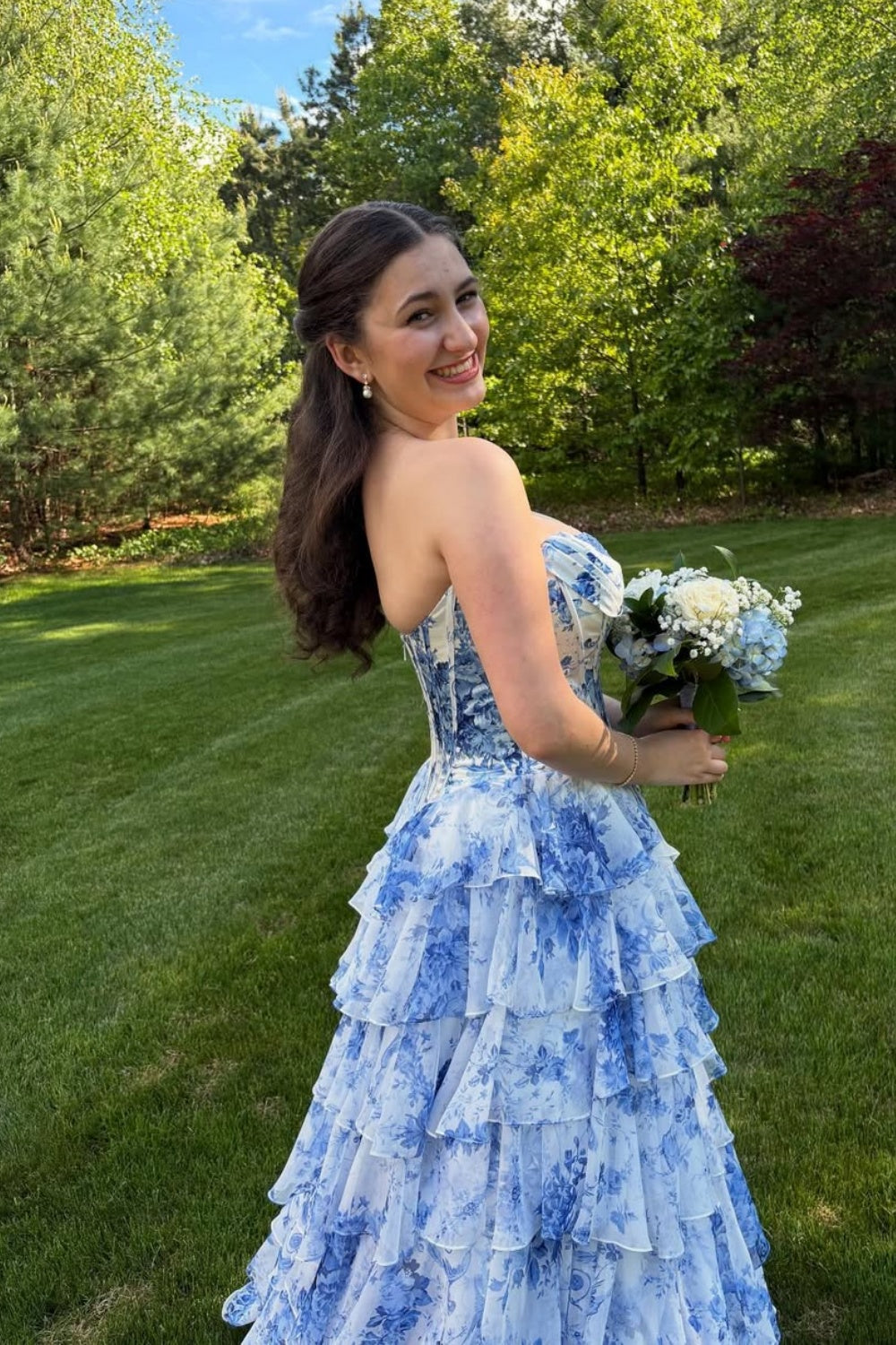 sweetheart corset A-line tiered gown with lace appliques and side slit.