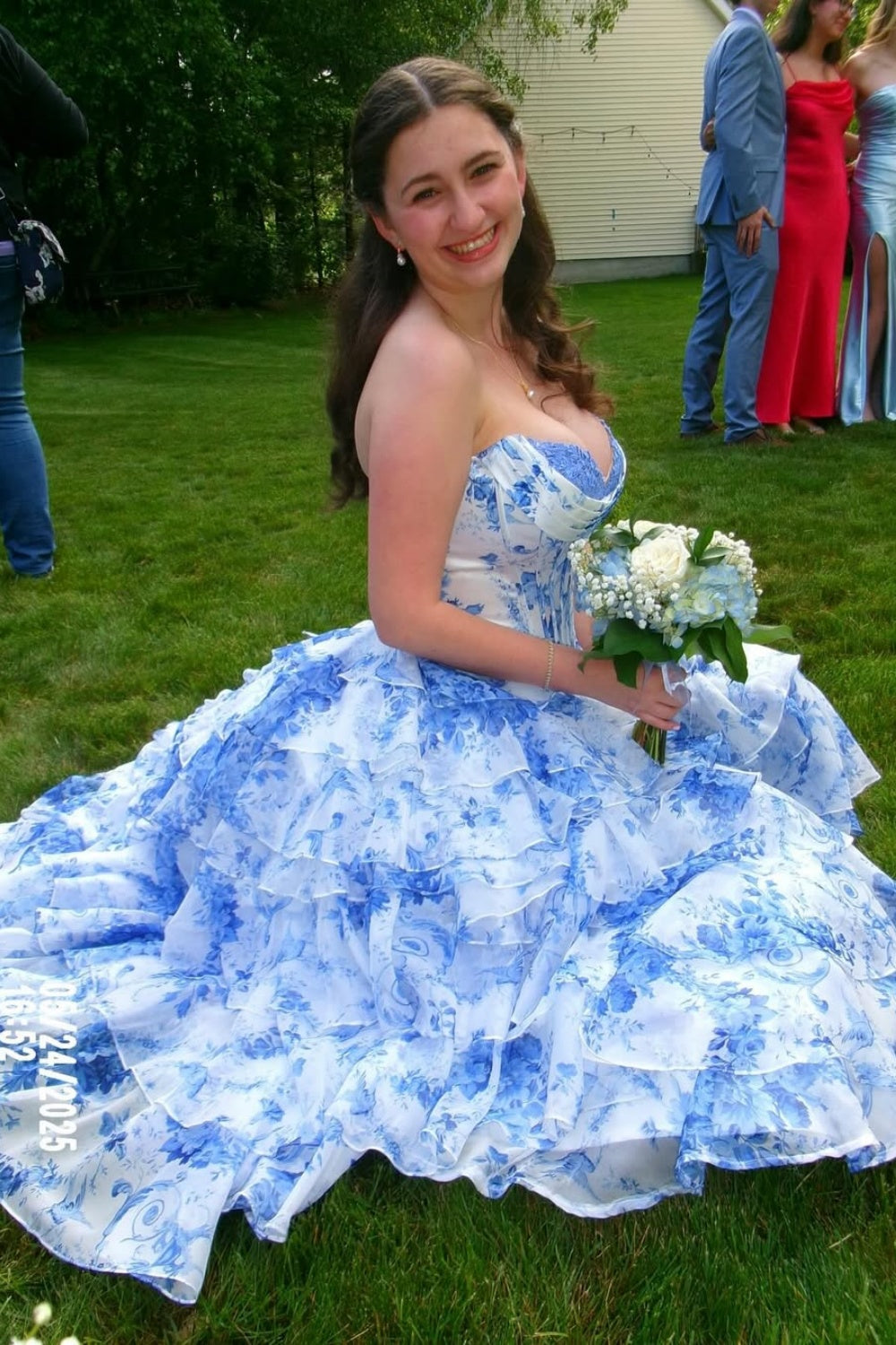 sweetheart corset A-line tiered gown with lace appliques and side slit.