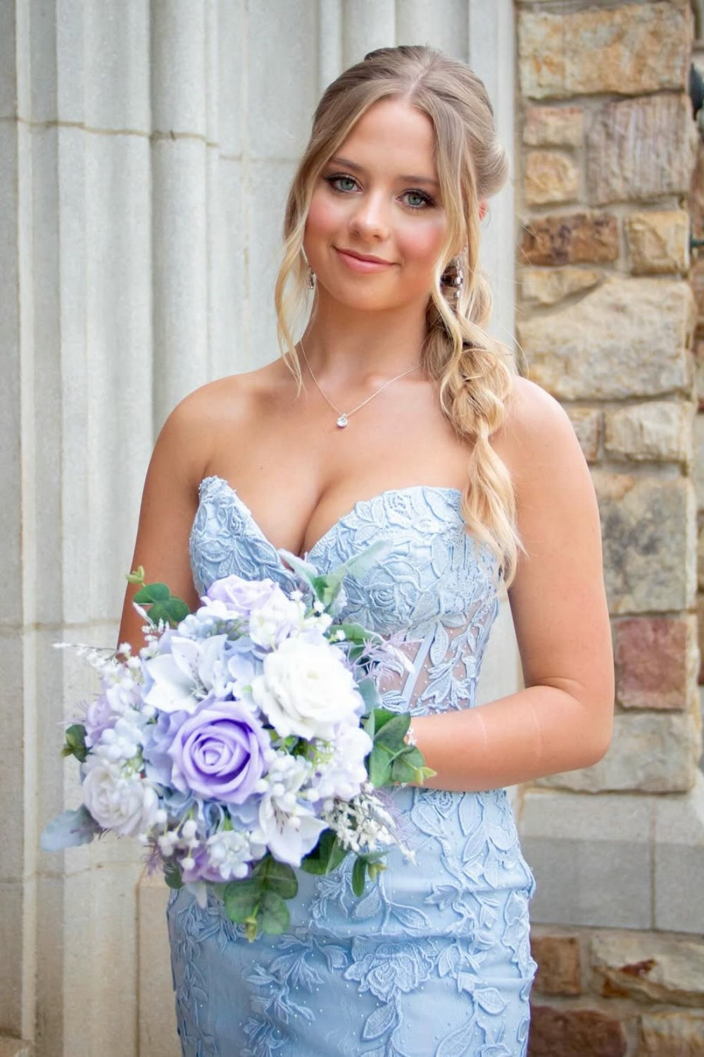 Light blue sweetheart mermaid prom dress featuring intricate beaded lace appliques and a high side leg slit.