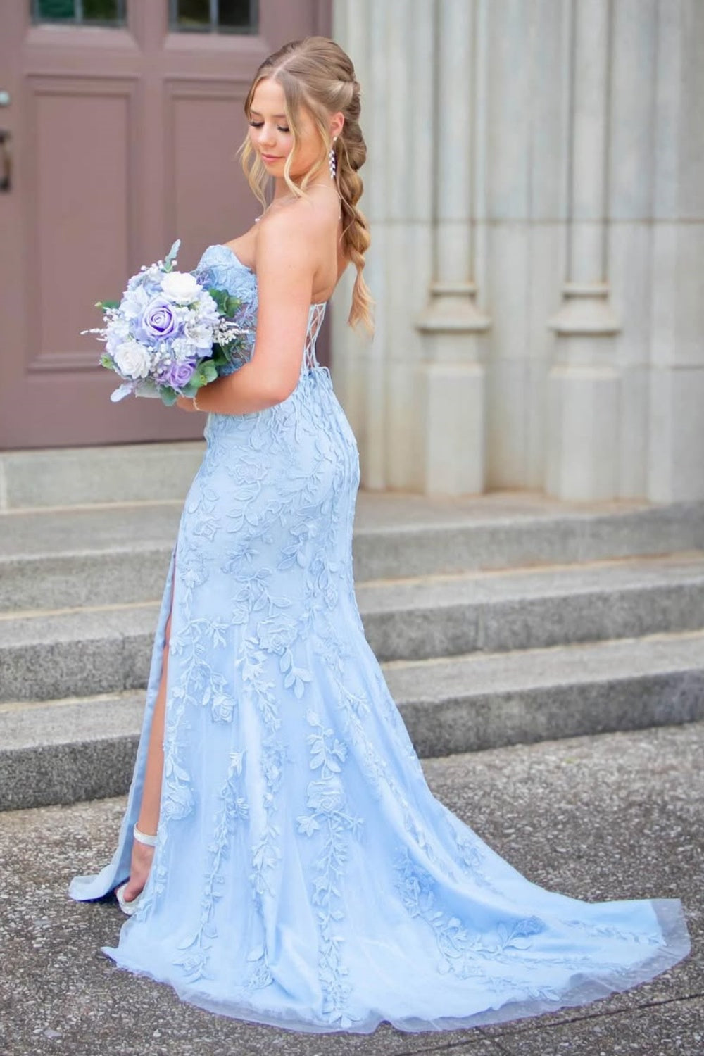 Light blue sweetheart mermaid prom dress featuring intricate beaded lace appliques and a high side leg slit.
