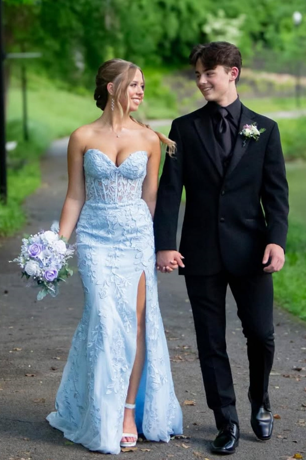Light blue sweetheart mermaid prom dress featuring intricate beaded lace appliques and a high side leg slit.
