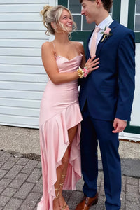 Pink A-line prom dress featuring dainty spaghetti straps and a modern irregular asymmetric hemline.