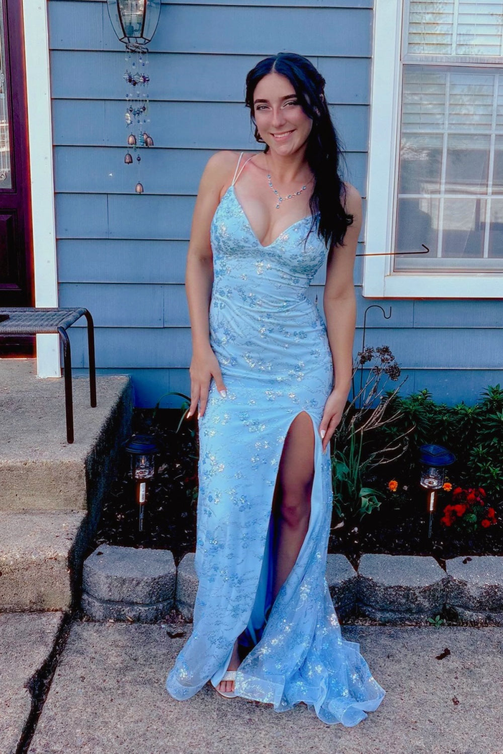 Blue mermaid prom dress featuring shimmering sequin appliques, trendy double spaghetti straps, and a high side leg slit.