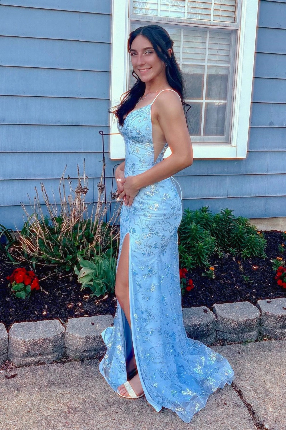 Blue mermaid prom dress featuring shimmering sequin appliques, trendy double spaghetti straps, and a high side leg slit.