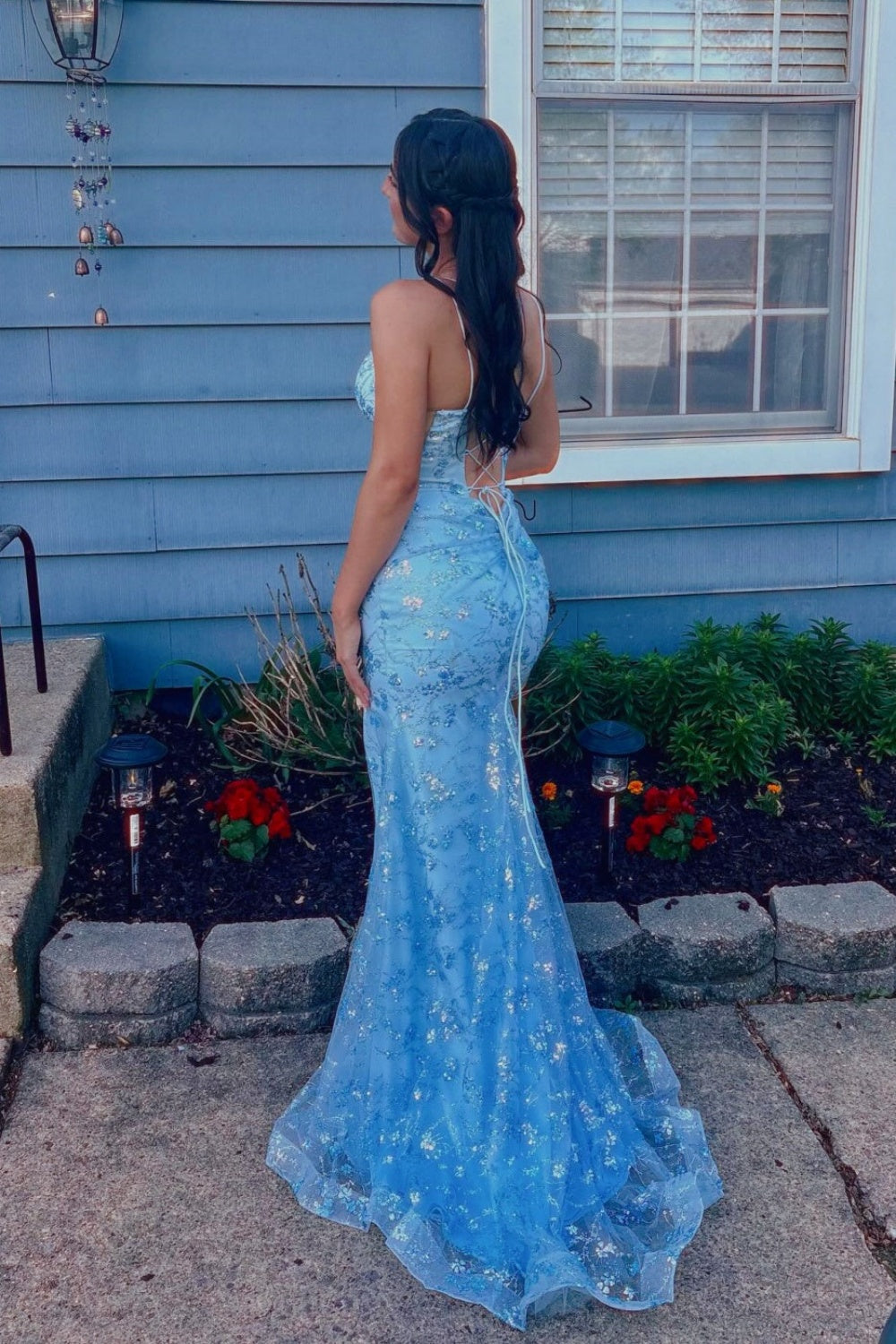 Blue mermaid prom dress featuring shimmering sequin appliques, trendy double spaghetti straps, and a high side leg slit.