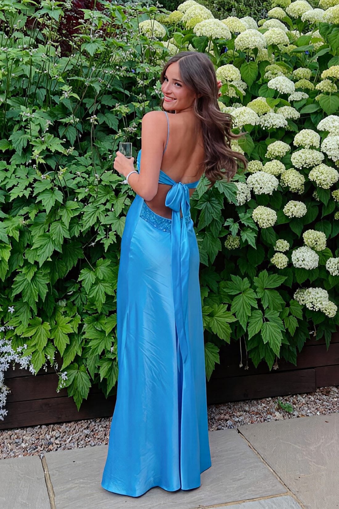 Blue mermaid satin prom dress featuring shimmering beaded spaghetti straps and a sleek, fitted silhouette.