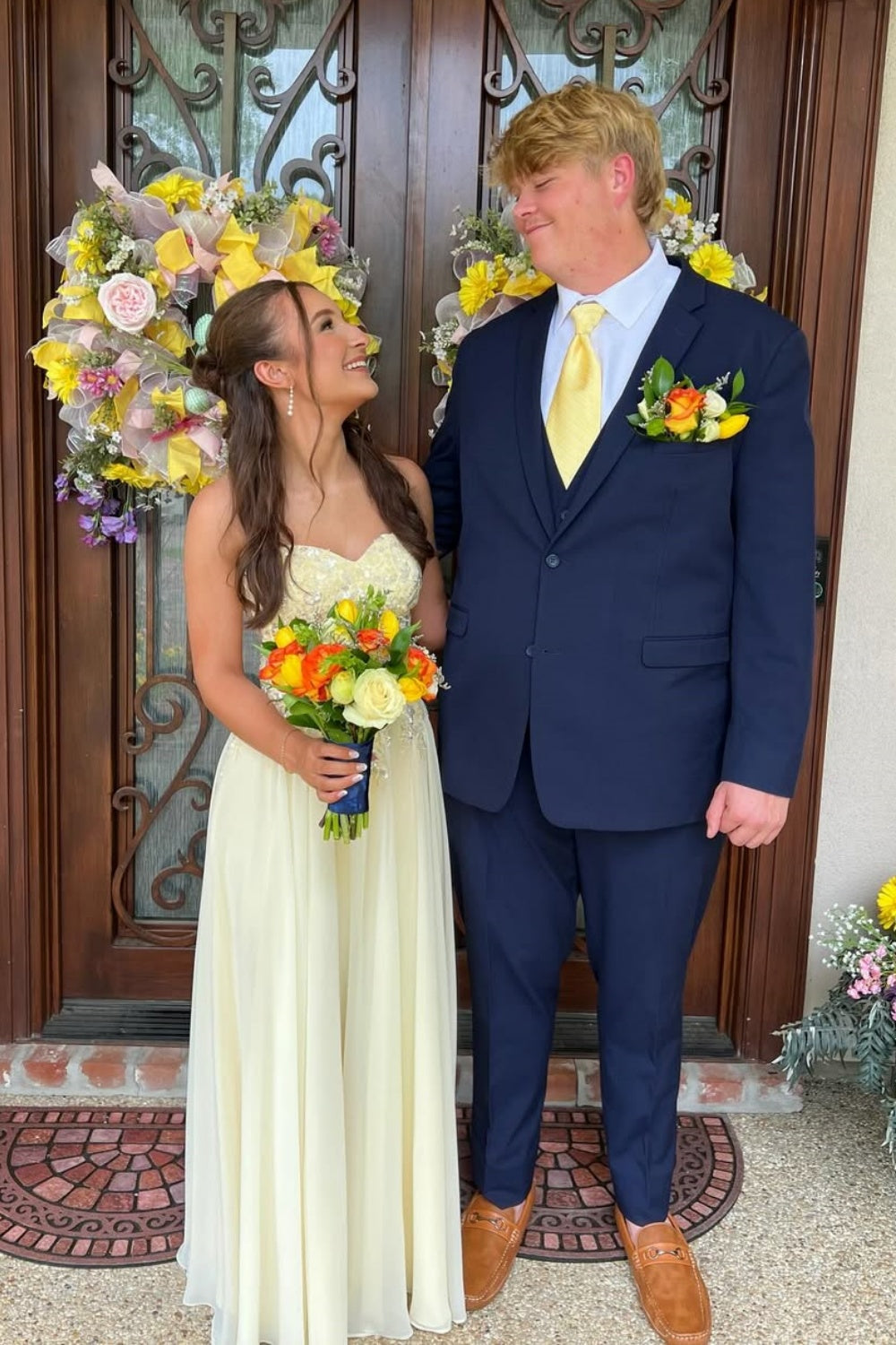 Yellow A-line formal dress featuring sweetheart neckline and lace appliques.
