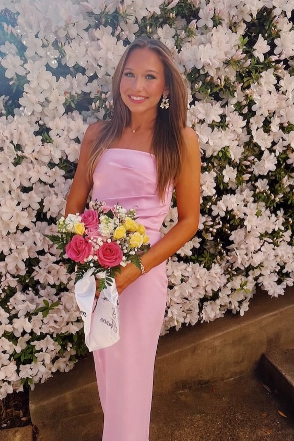 Pink strapless satin fitted gown with ruching.