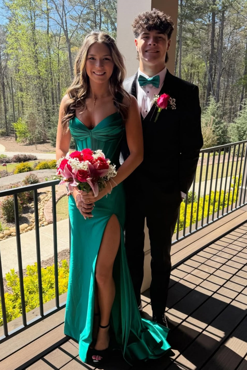Pleated mermaid prom dress with spaghetti straps and side slit.