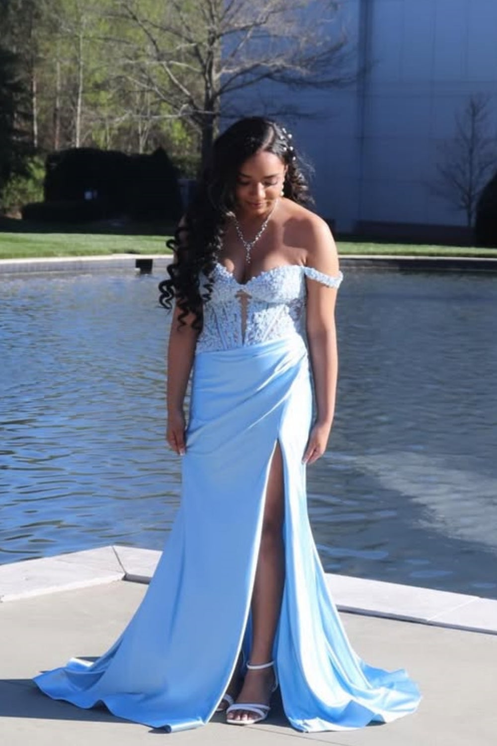 Light blue off-shoulder dress with lace appliqués and illusion corset.
