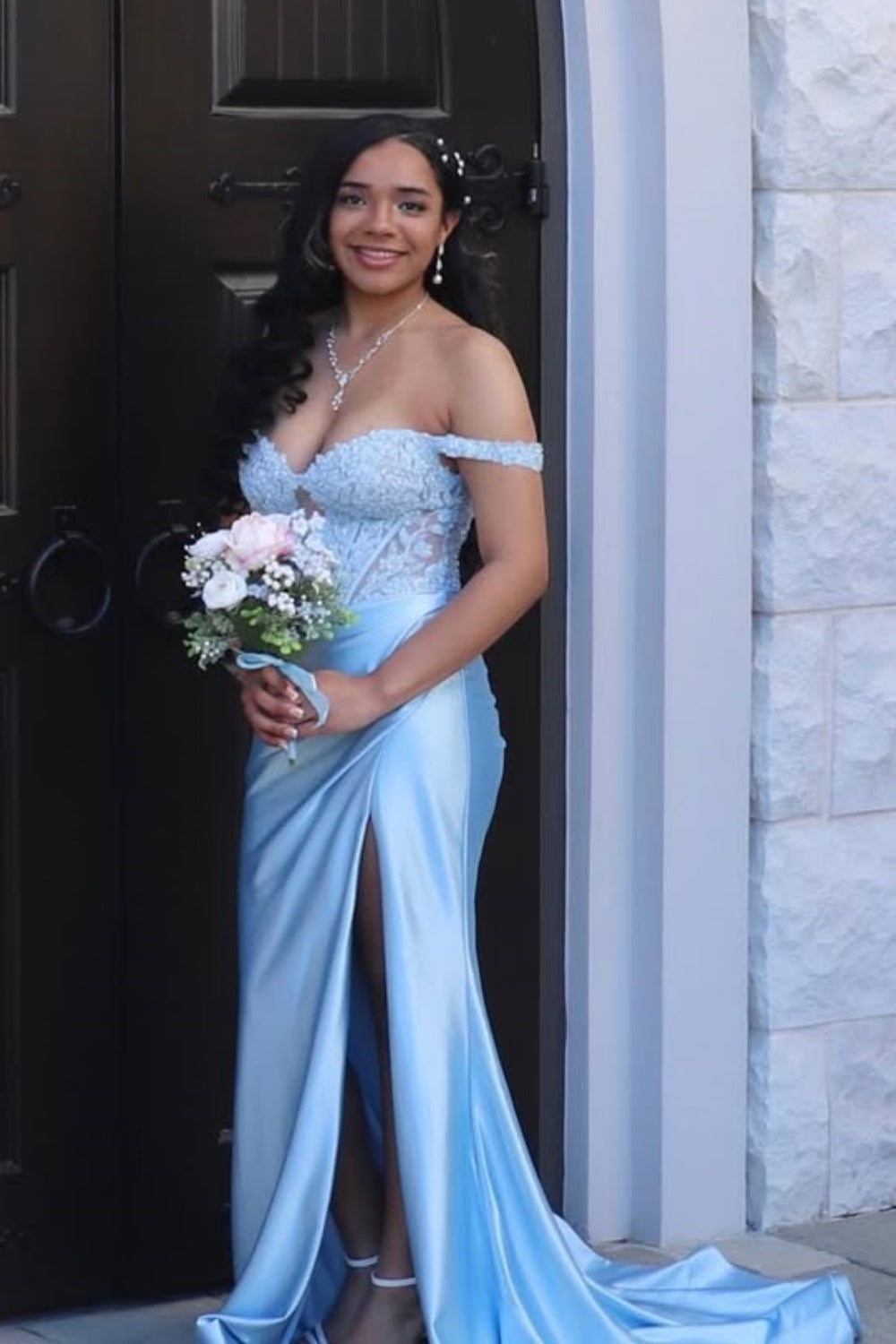 Light blue off-shoulder dress with lace appliqués and illusion corset.
