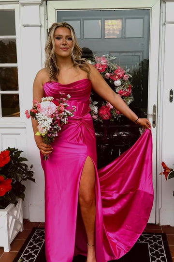 Fuchsia pleated neckline mermaid dress with twist detail and side slit.
