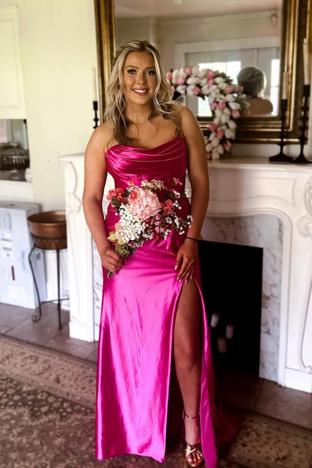 Fuchsia pleated neckline mermaid dress with twist detail and side slit.