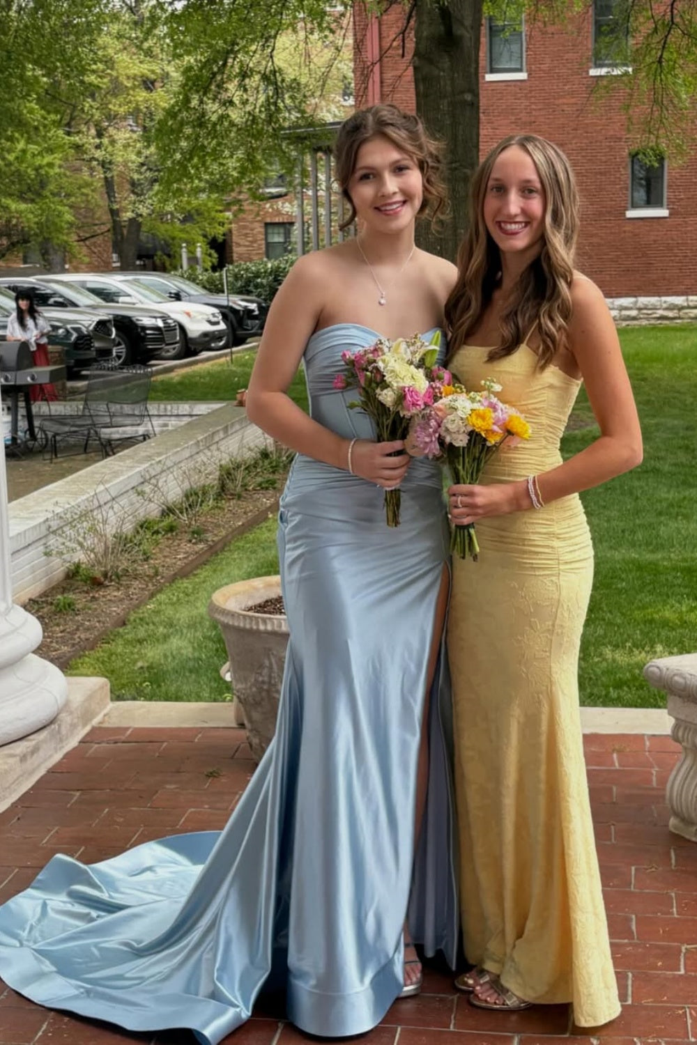Light blue pleated mermaid dress with side slit and long train.