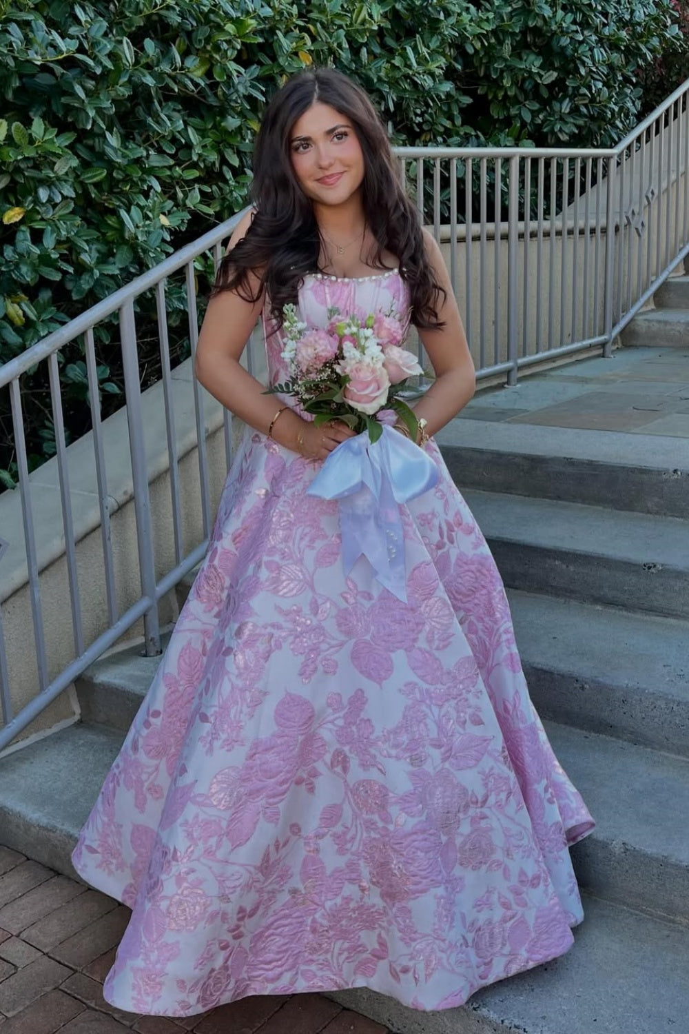 Floral print A-line dress with lace appliqués and pearl neckline.