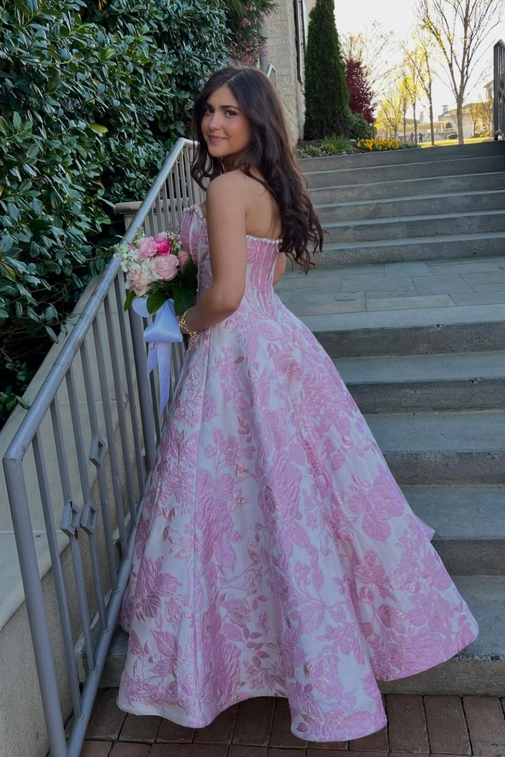 Floral print A-line dress with lace appliqués and pearl neckline.